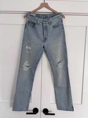 Levi’s 501 distressed light blue straight leg jeans, 28x32